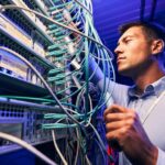 engineer-testing-cable-connections-on-network-server