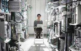 caucasian-male-technician-working-on-computer-servers-in-a-computer-server-farm-